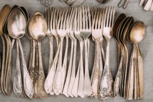 Set Of Retro, Old, Vintage Cutlery Spoons And Forks On Gray Background. Top View